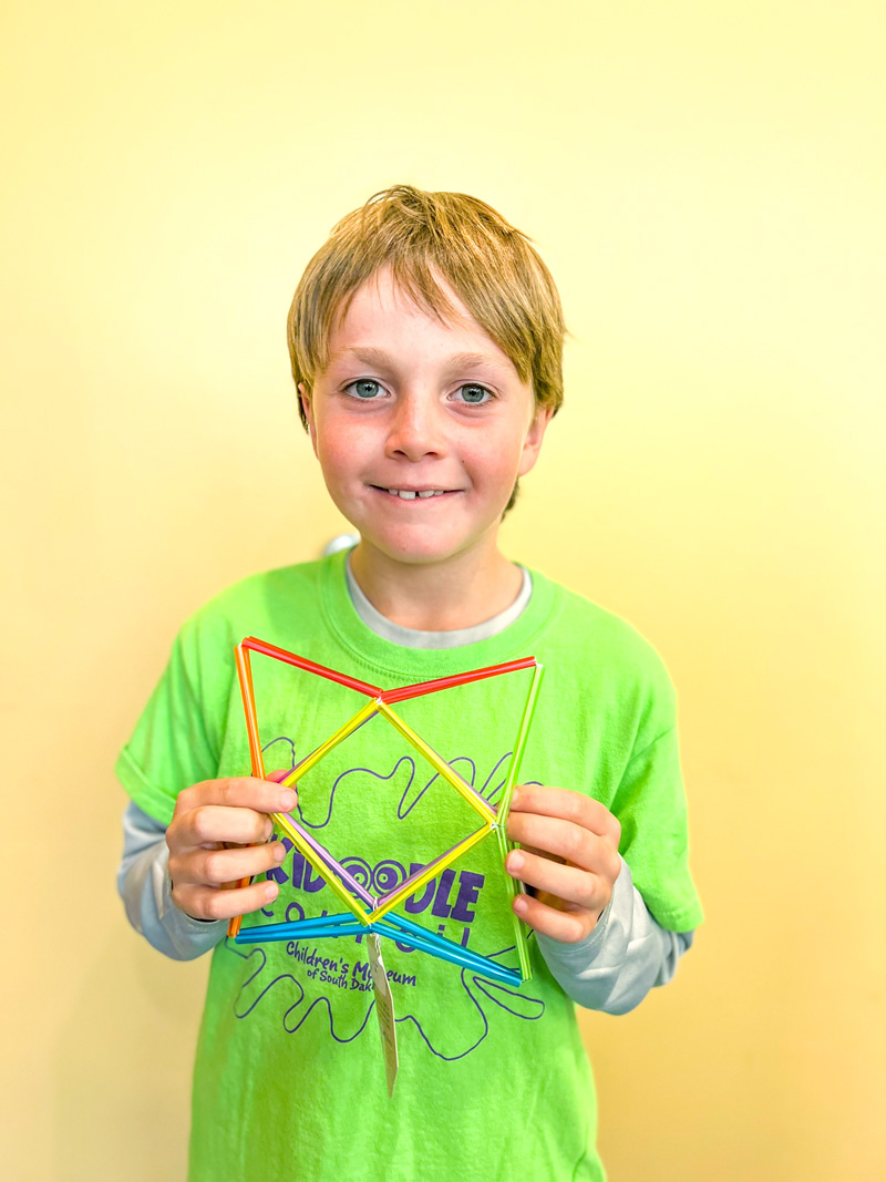 boy holding a geo-twister toy