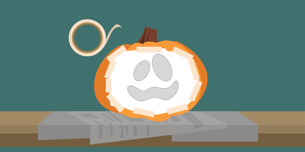 3. Tape your printed out stencil onto the face of your pumpkin.
