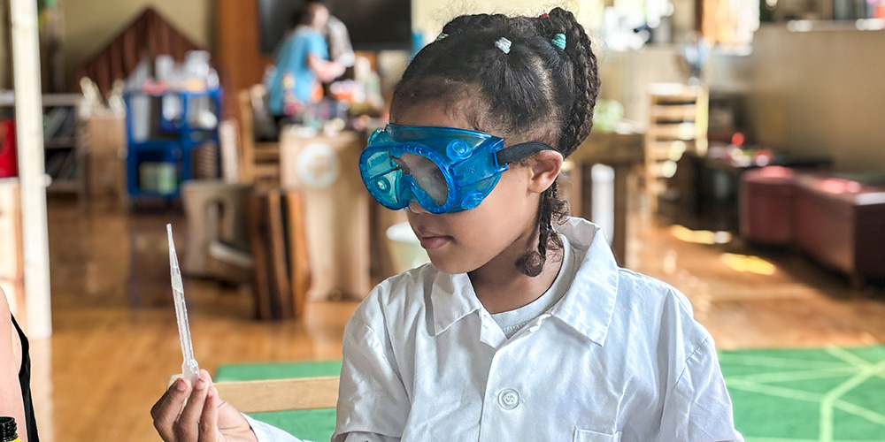 camper experimenting with science reactions