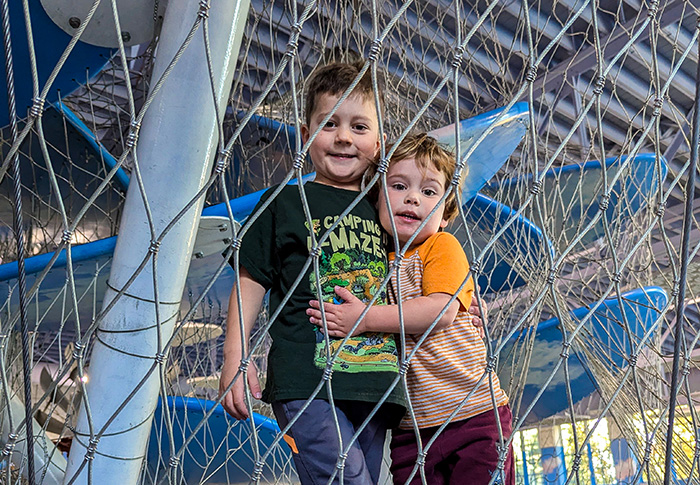 brothers standing in cloud climber